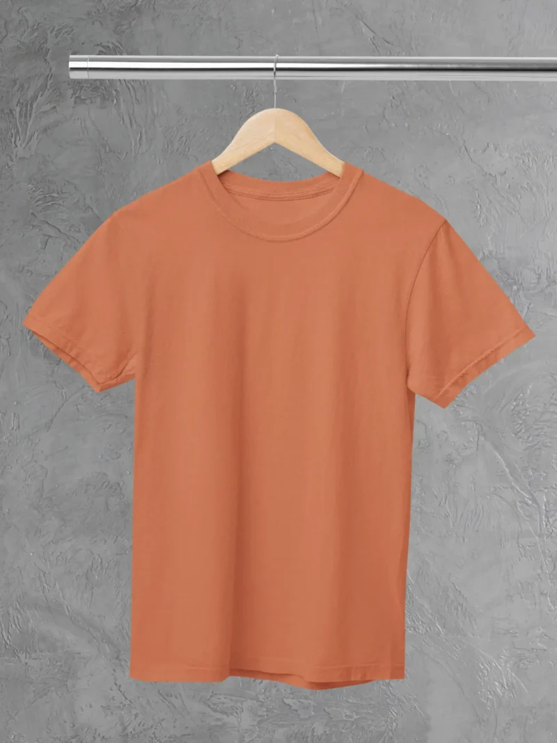 M4S Solids coral Unisex Tee Placed on a hanger
