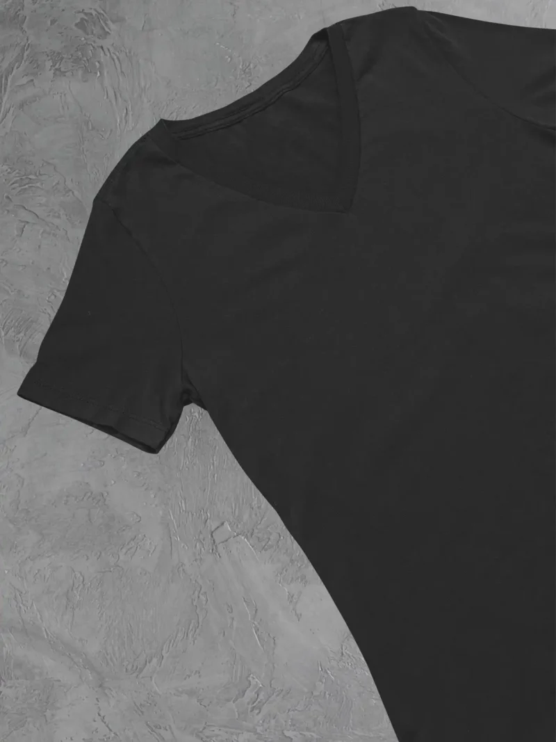 Close up of m4s solids v neck black unisex tee in a studio