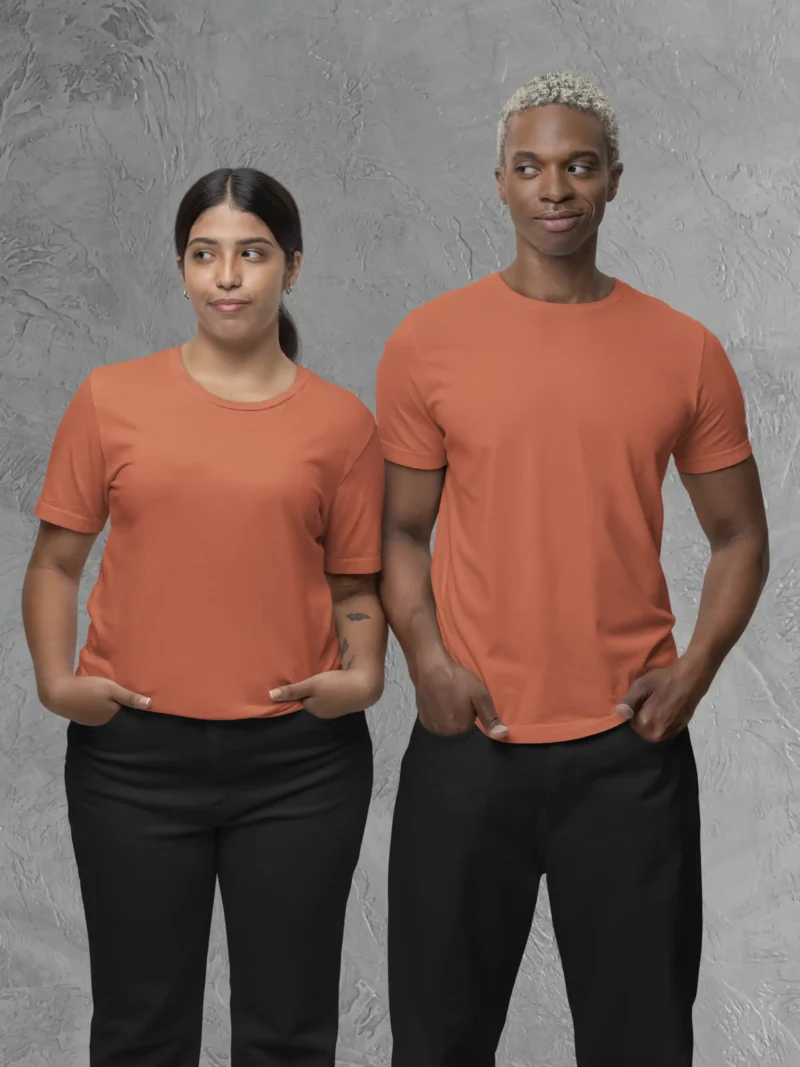 Couple posing in M4S Solids Coral Unisex Tee