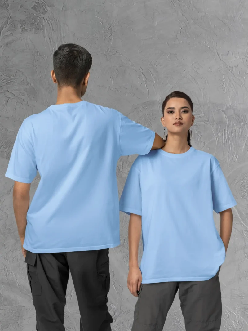 Couple posing in M4S Solids Oversized Baby Blue Unisex Tee