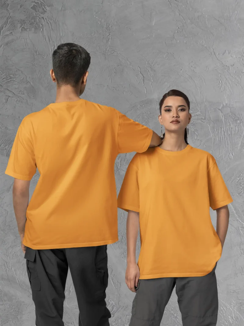 Couple posing in M4S Solids Oversized Golden Yellow Unisex Tee