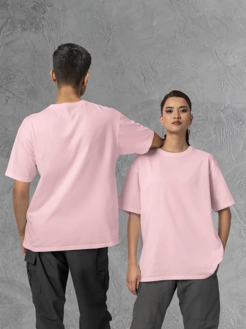 Couple posing in M4S Solids Oversized Light Pink Unisex Tee