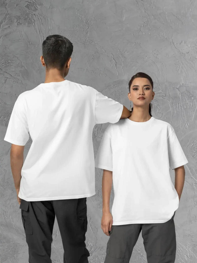 Couple posing in M4S Solids Oversized White Unisex Tee