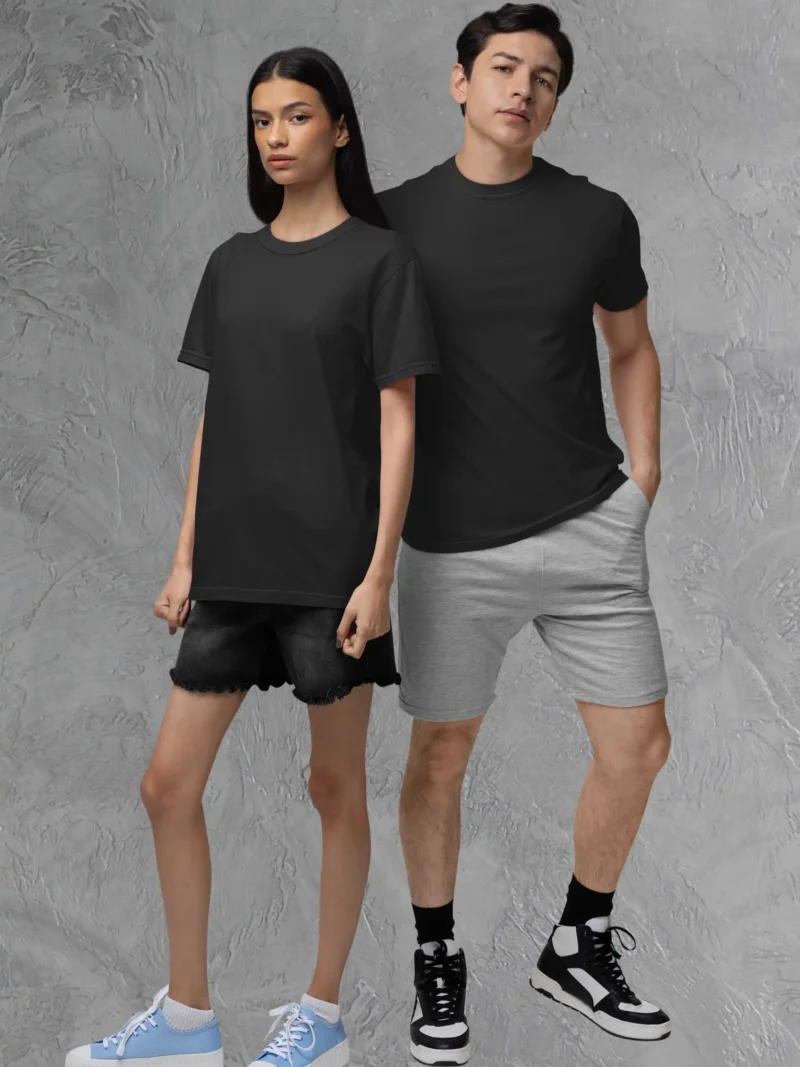 Couple posing in M4S Solids Stretch Black Unisex Tee