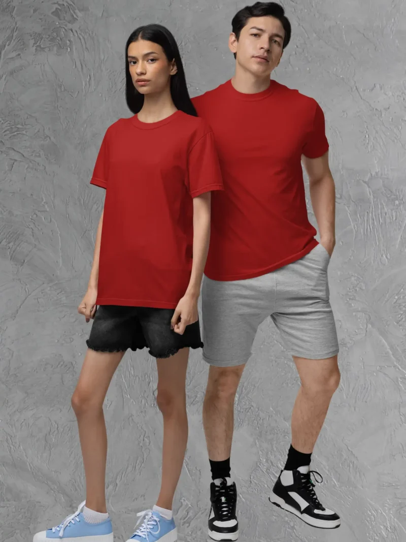 Couple posing in M4S Solids Stretch Red Unisex Tee