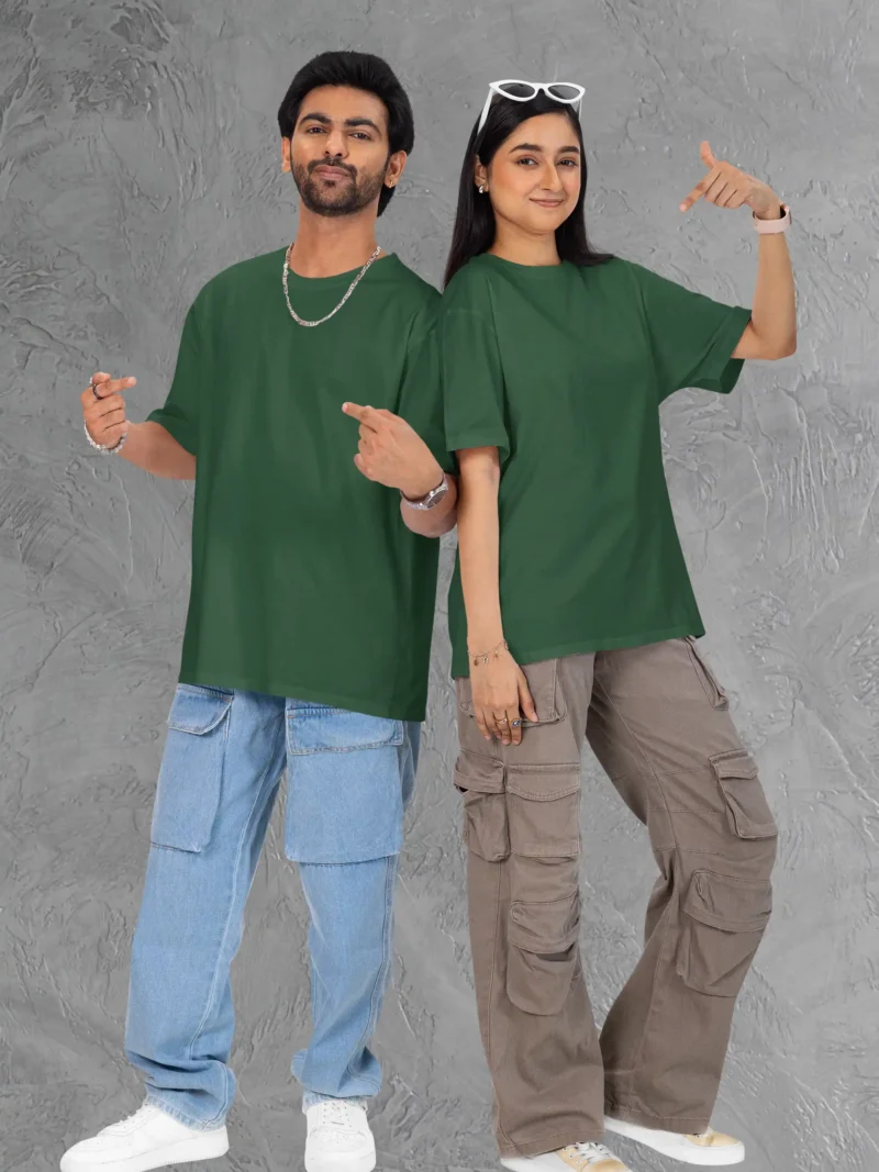 Couple posing in M4S Solids Terry Oversized Bottle Green Unisex Tee