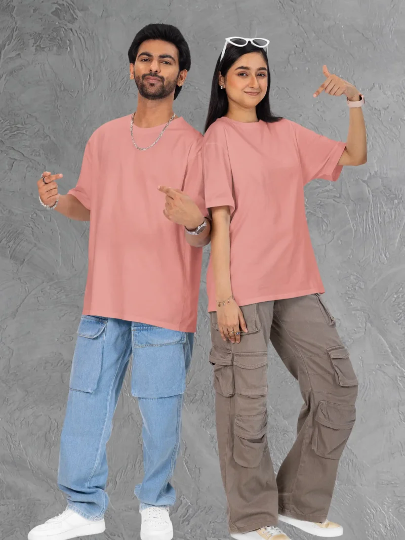 Couple posing in M4S Solids Terry Oversized Flamingo Unisex Tee