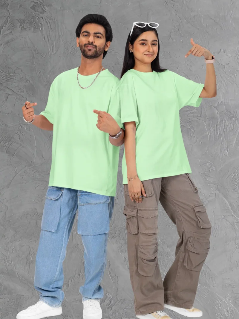Couple posing in M4S Solids Terry Oversized Jade Unisex Tee