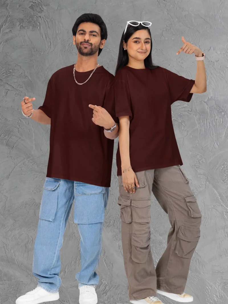 Couple posing in M4S Solids Terry Oversized Maroon Unisex Tee