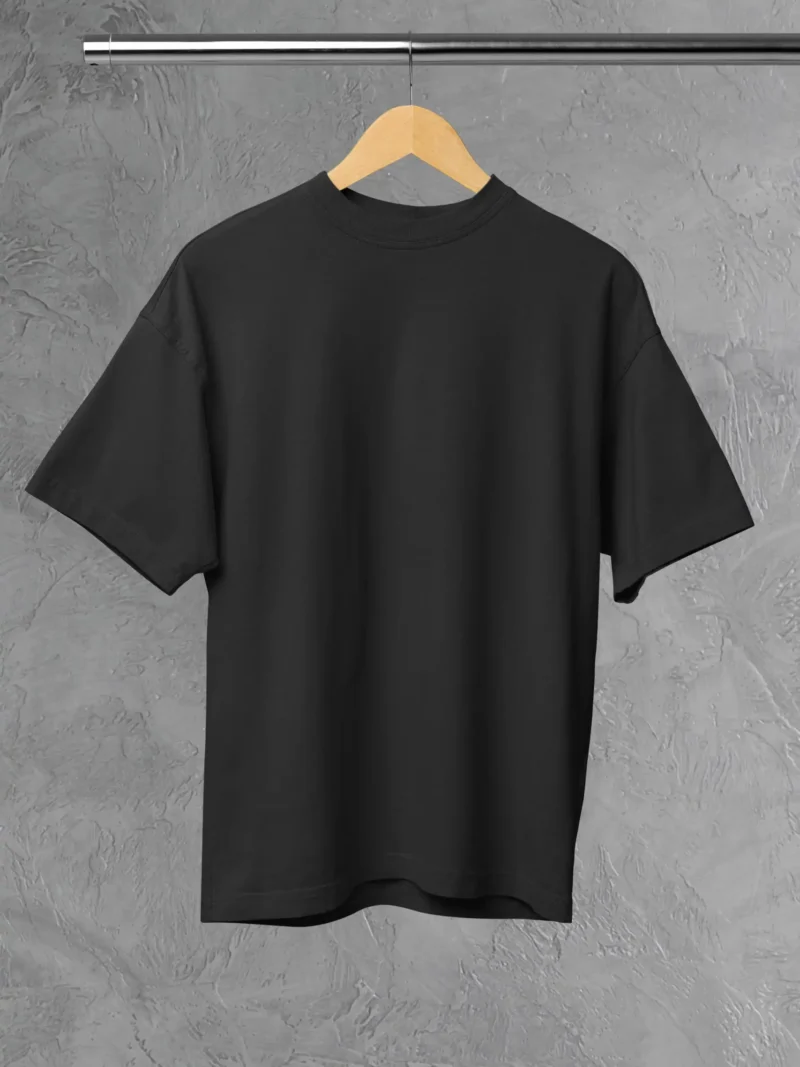 M4S Solids Oversized Black Unisex Tee Placed on a hanger