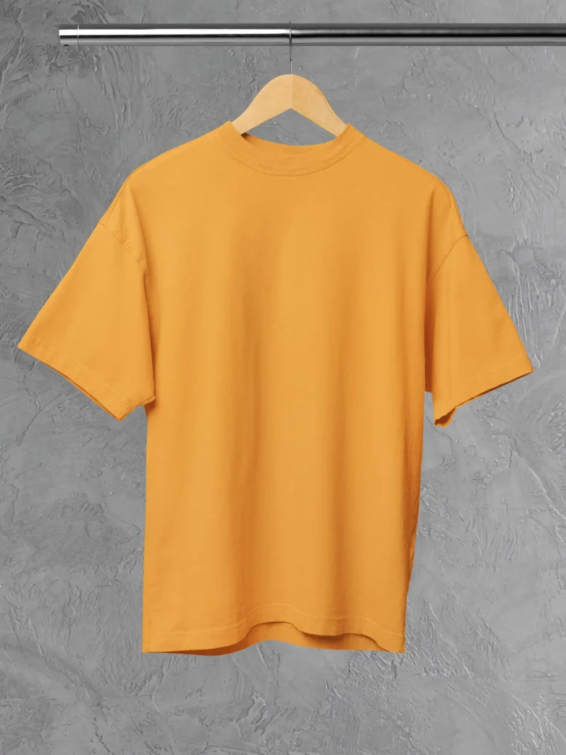 M4S Solids Oversized Golden Yellow Unisex Tee Placed on a hanger