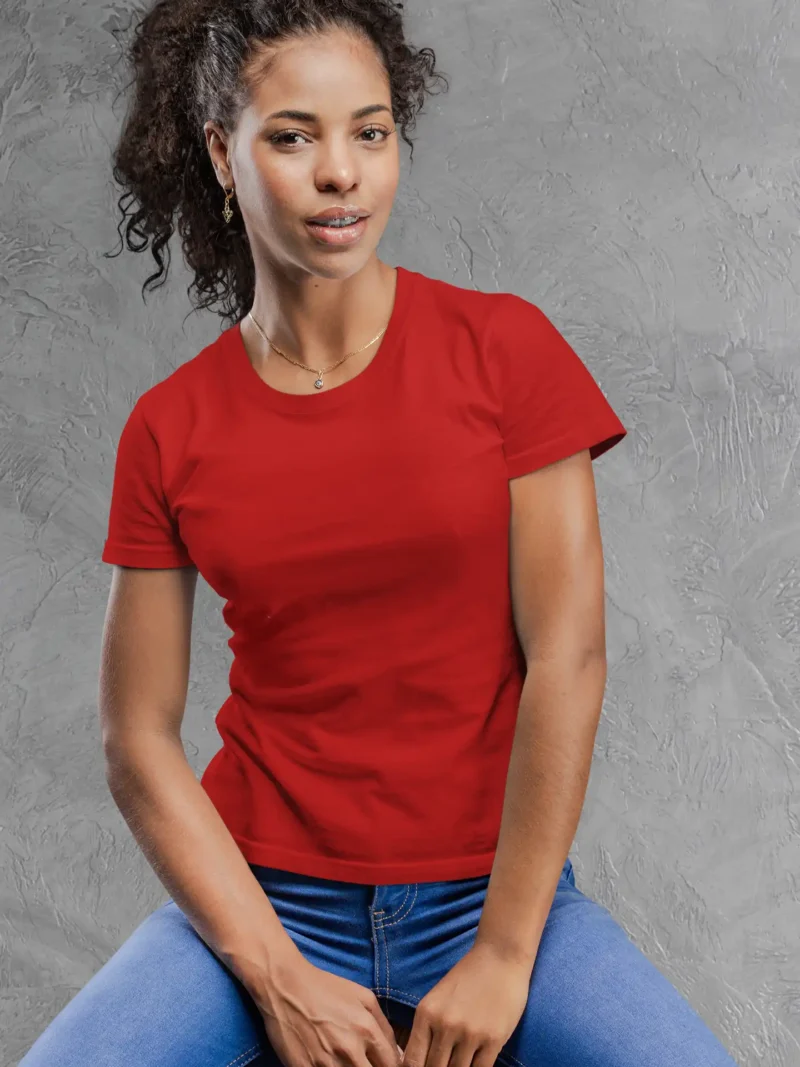 Model wearing M4S Solids Female Classic Red Tee against a concrete backdrop