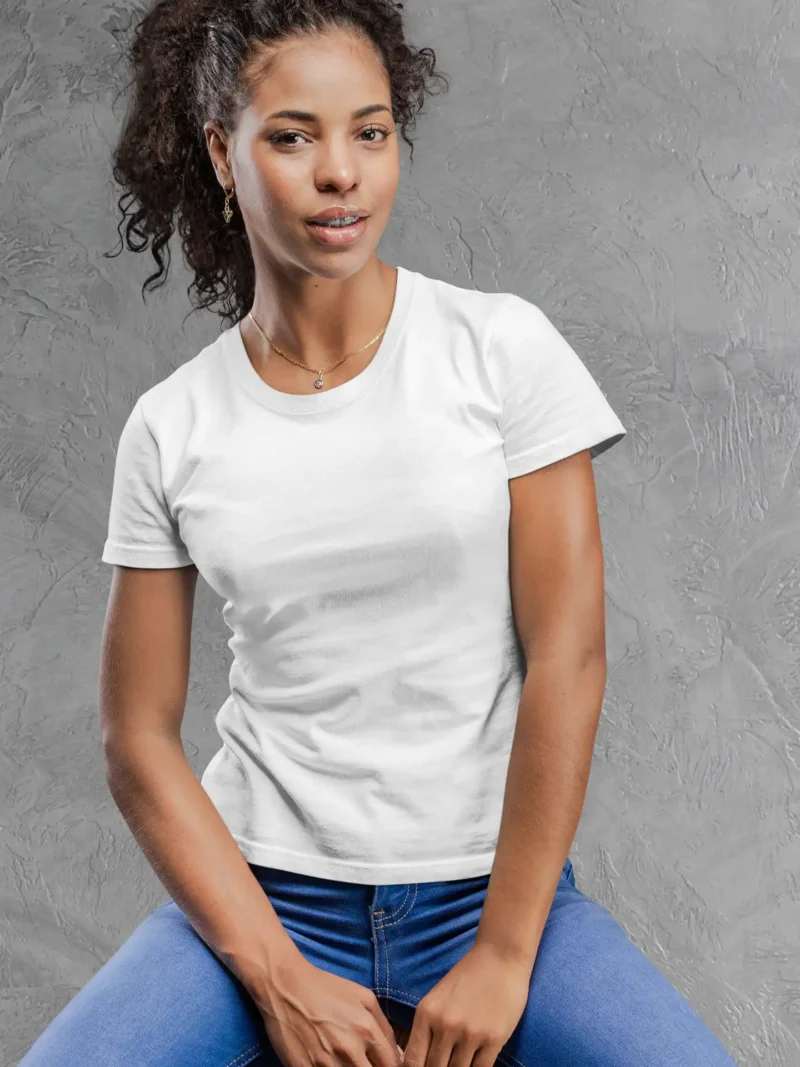 Model wearing M4S Solids Female Classic White Tee against a concrete backdrop