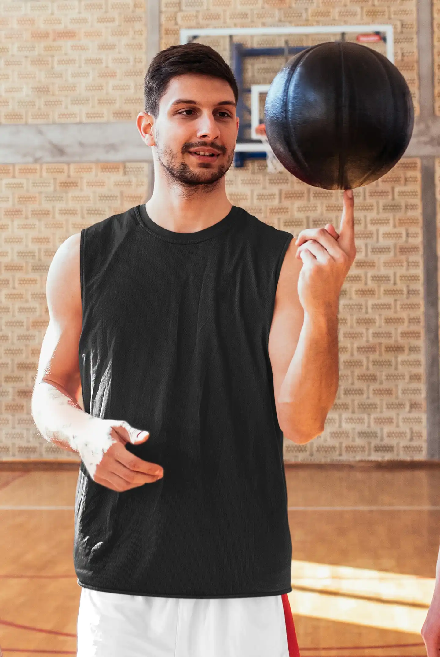 Man wearing M4S Solids Male Black Sleeveless T-Shirt spinning ball Man wearing M4S Solids Male Black Sleeveless T-Shirt spinning ball
