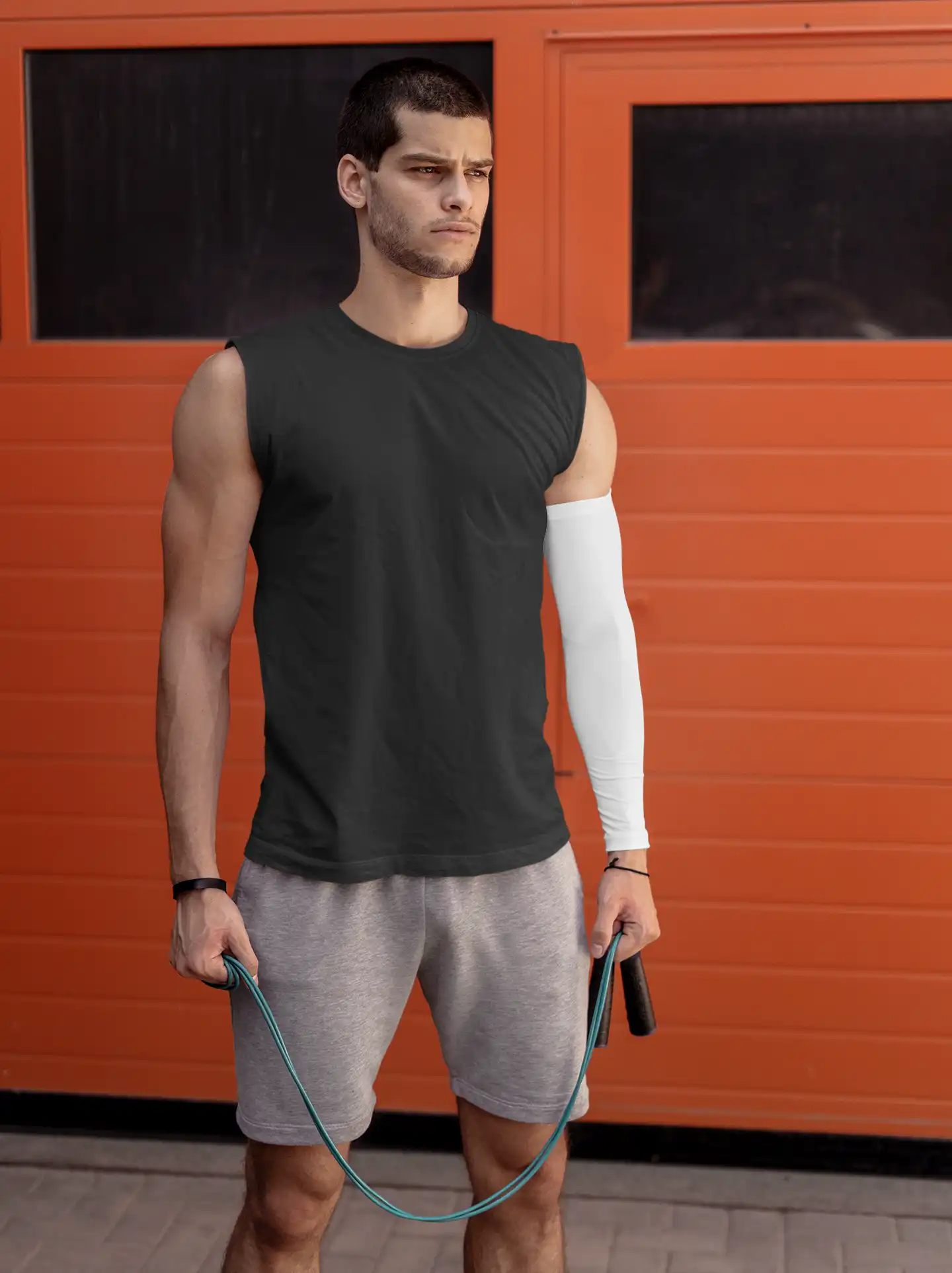 Man wearing M4S Solids Male Black Sleeveless T-Shirt working out Man wearing M4S Solids Male Black Sleeveless T-Shirt working out