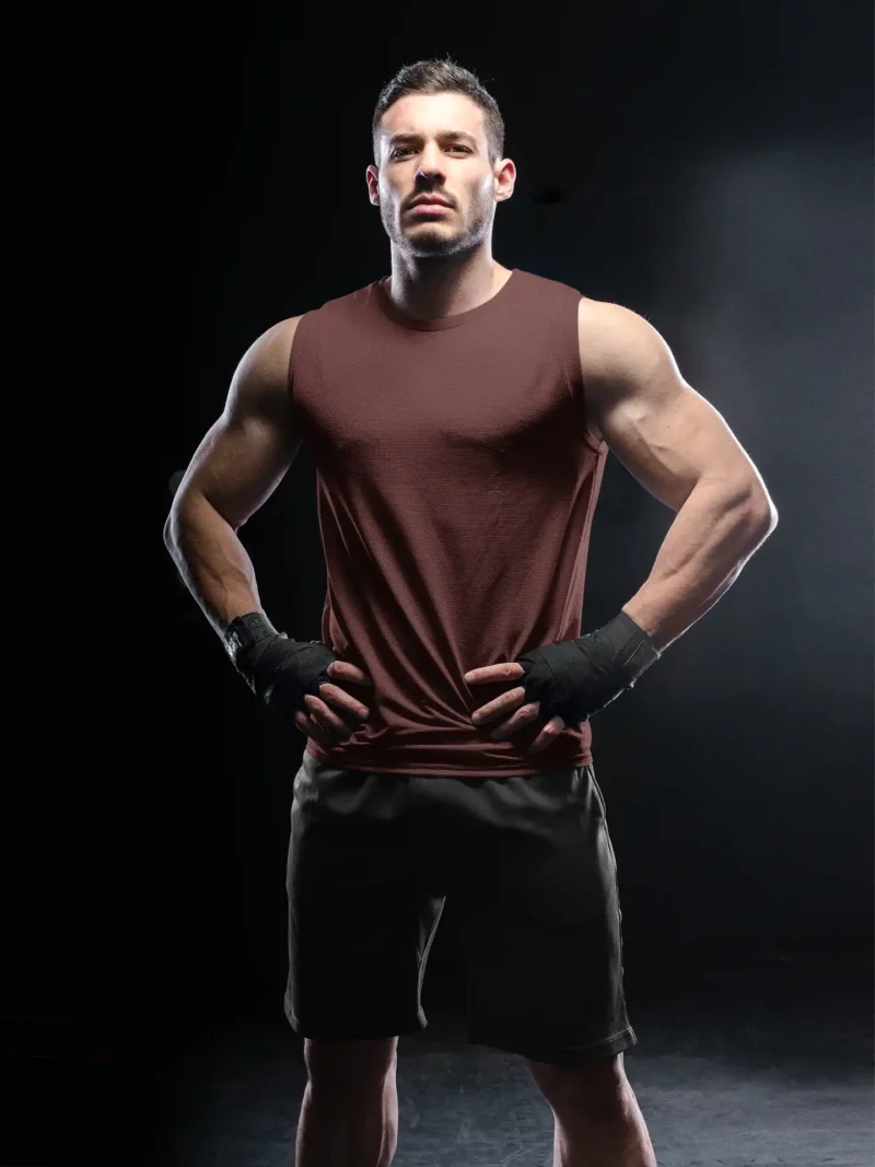 Man wearing M4S Solids Male Maroon Sleeveless Tee in a studio