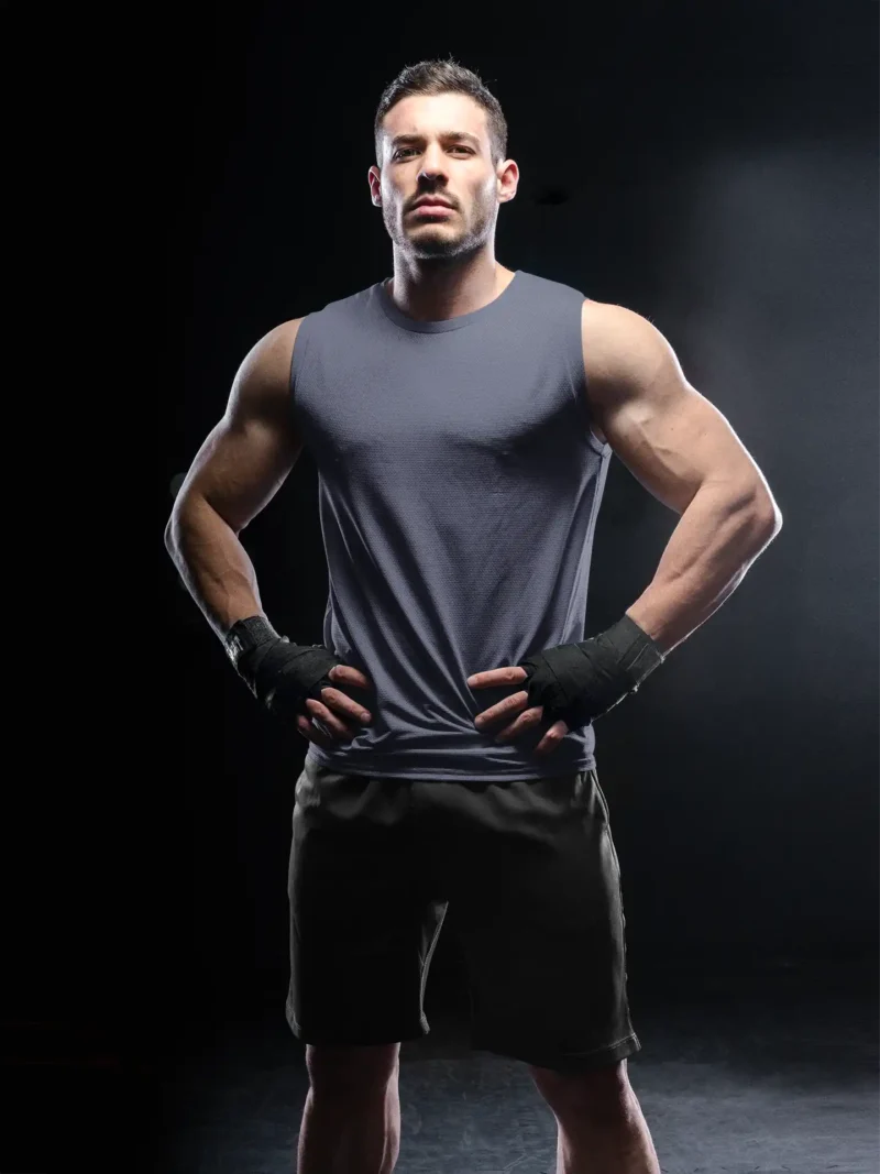 Man wearing M4S Solids Male Navy Blue Sleeveless Tee in a studio