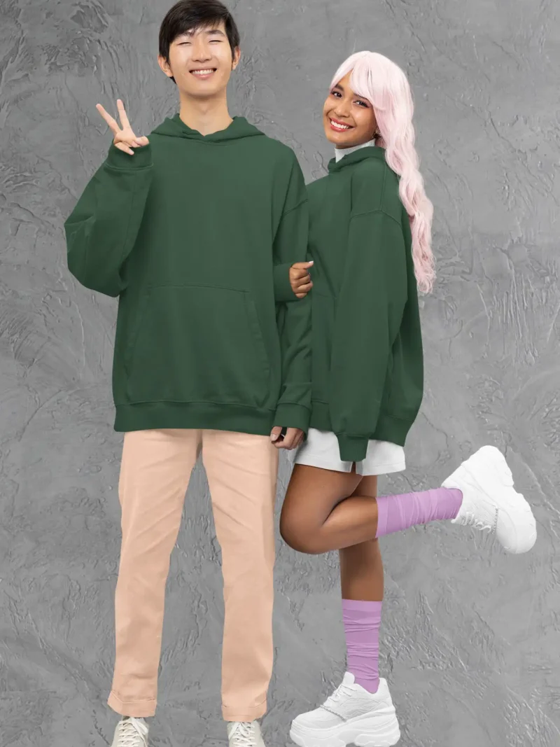 Couple wearing M4S Solids Bottle Green Unisex Oversized Hoodie