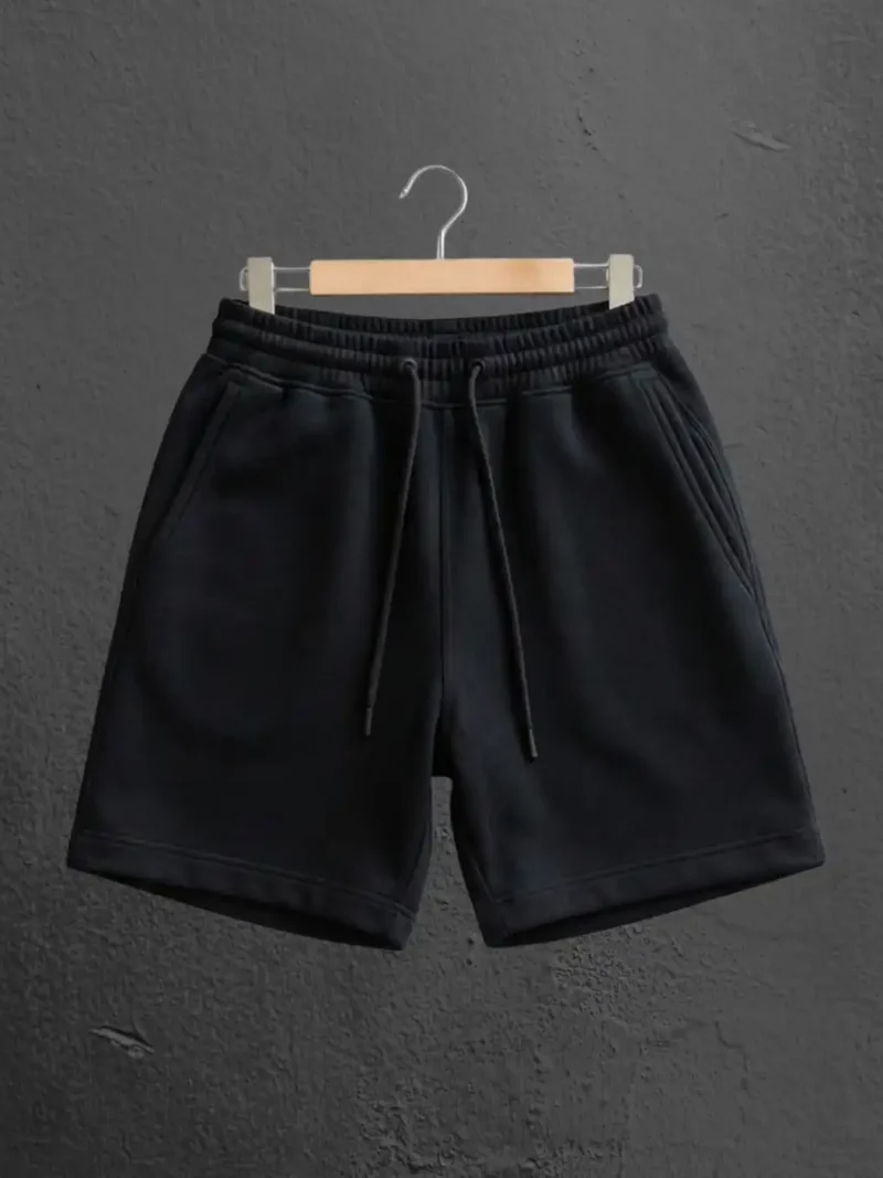 M4S Solids Black Unisex Terry Shorts on a hanger