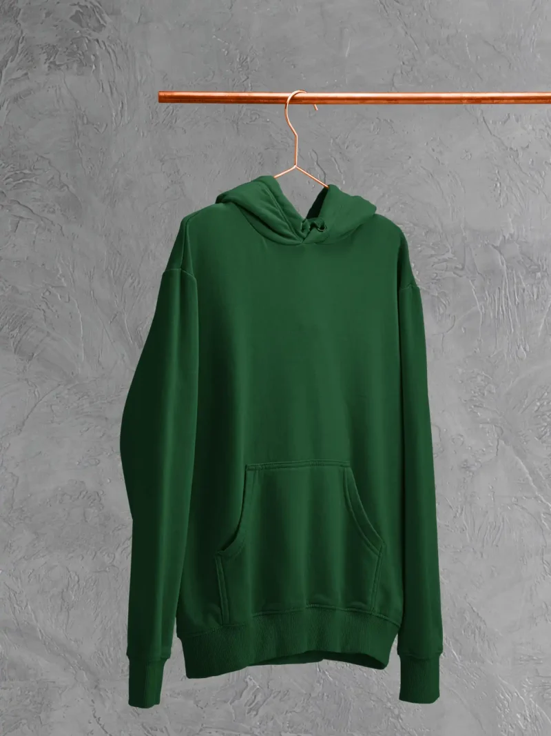 M4S Solids Bottle Green Unisex Oversized Hoodie placed on a hanger
