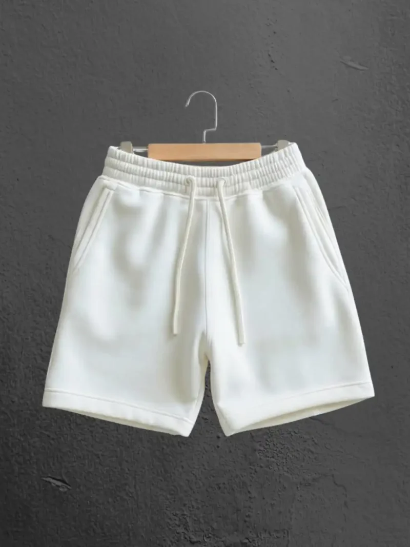 M4S Solids White Unisex Terry Shorts on a hanger