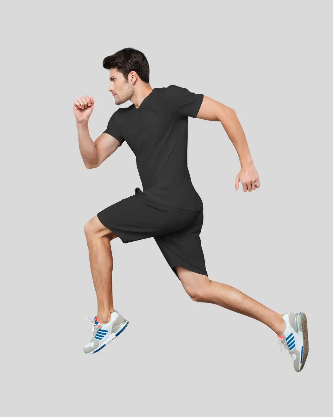 Man wearing M4S Solids Black Unisex Terry Shorts in a studio Man wearing M4S Solids Black Unisex Terry Shorts in a studio