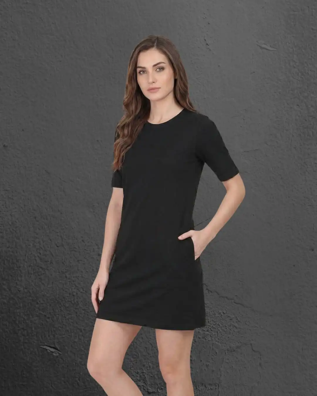 Female model wearing M4S Solids Black T-Shirt Dress 2 Female model wearing M4S Solids Black T-Shirt Dress 2