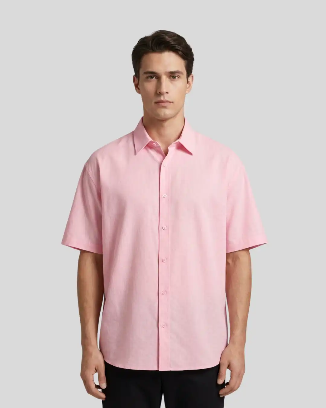 Man wearing M4S Solids Light Pink Unisex Oversized Shirt in a studio Man wearing M4S Solids Light Pink Unisex Oversized Shirt in a studio