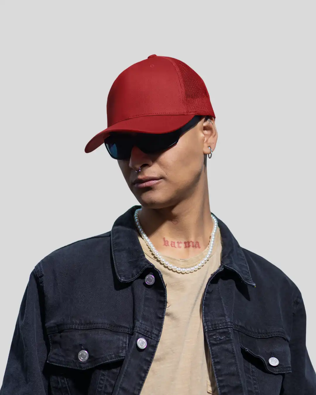 Man wearing M4S Solids Red Unisex Classic Trucker Cap in a studio Man wearing M4S Solids Red Unisex Classic Trucker Cap in a studio