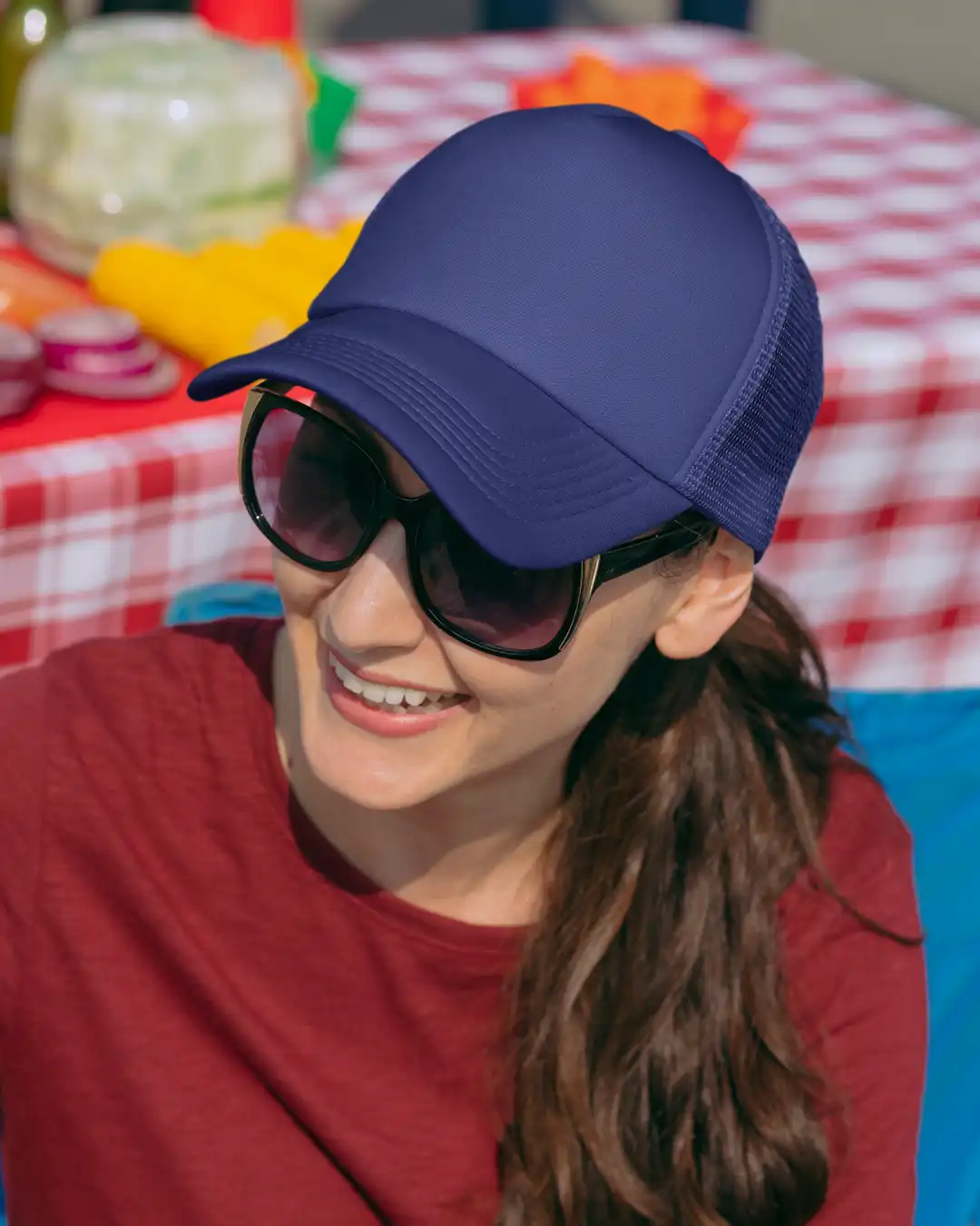 Woman wearing M4S Solids Royal Blue Unisex Classic Trucker Cap outdoors Woman wearing M4S Solids Royal Blue Unisex Classic Trucker Cap outdoors