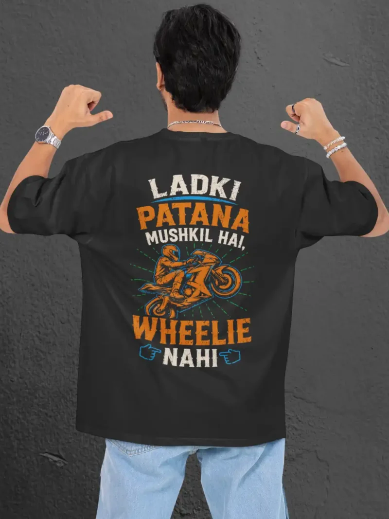 Man posing in Ladki Patana Mushkil Hai Black oversized Tee