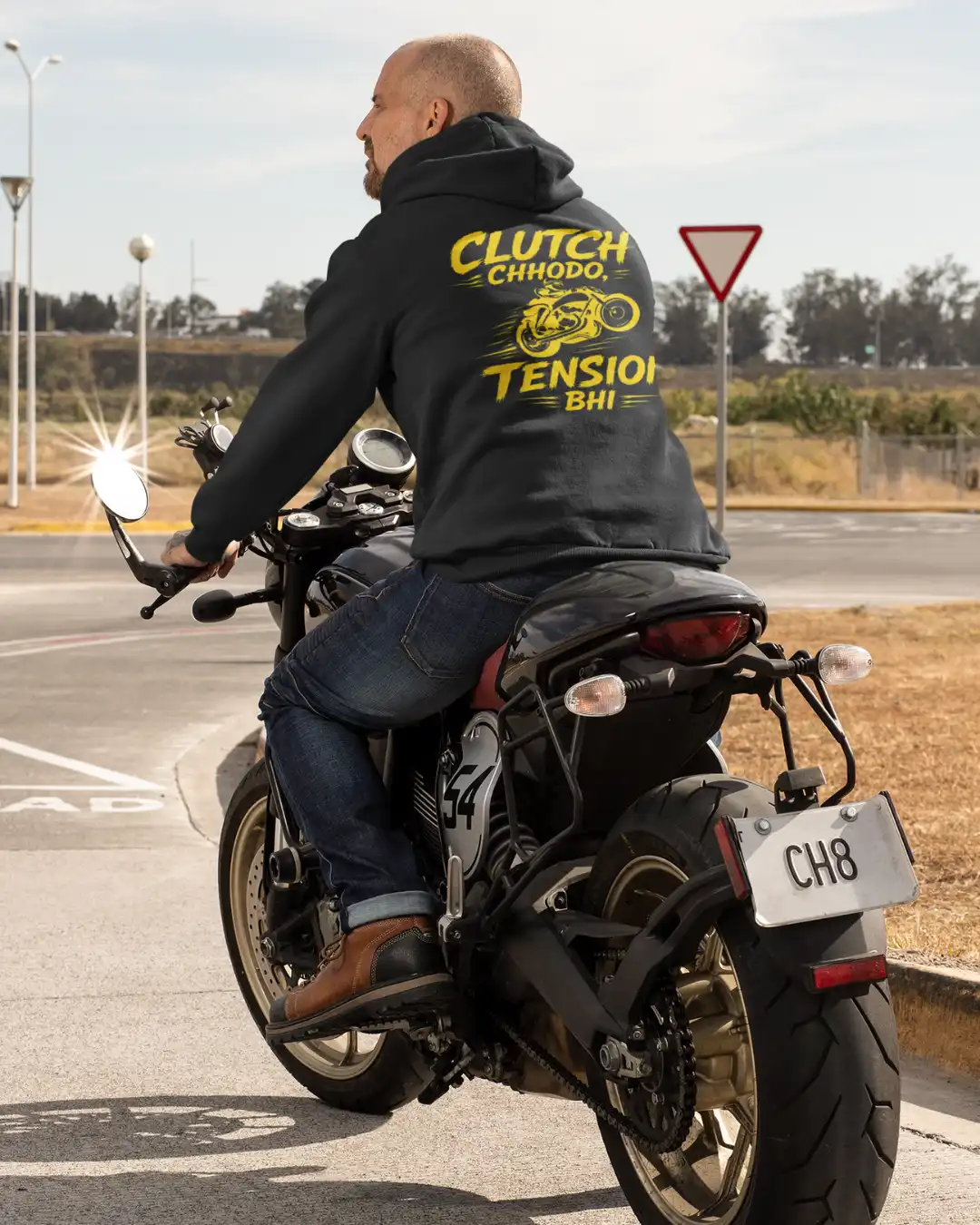 Outdoor Shot of a man on a bike wearing Clutch Chhodo Black Terry Pullover Hoodie Outdoor Shot of a man on a bike wearing Clutch Chhodo Black Terry Pullover Hoodie