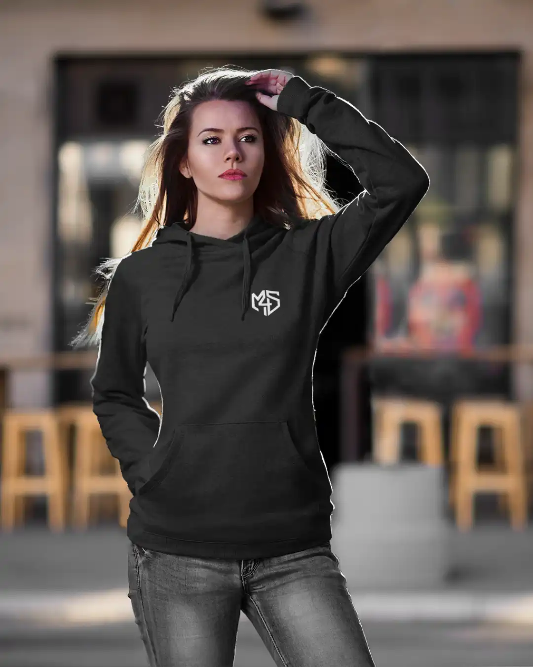 Outdoor shot of a woman in Clutch Chhodo Black Terry Pullover Hoodie Outdoor shot of a woman in Clutch Chhodo Black Terry Pullover Hoodie