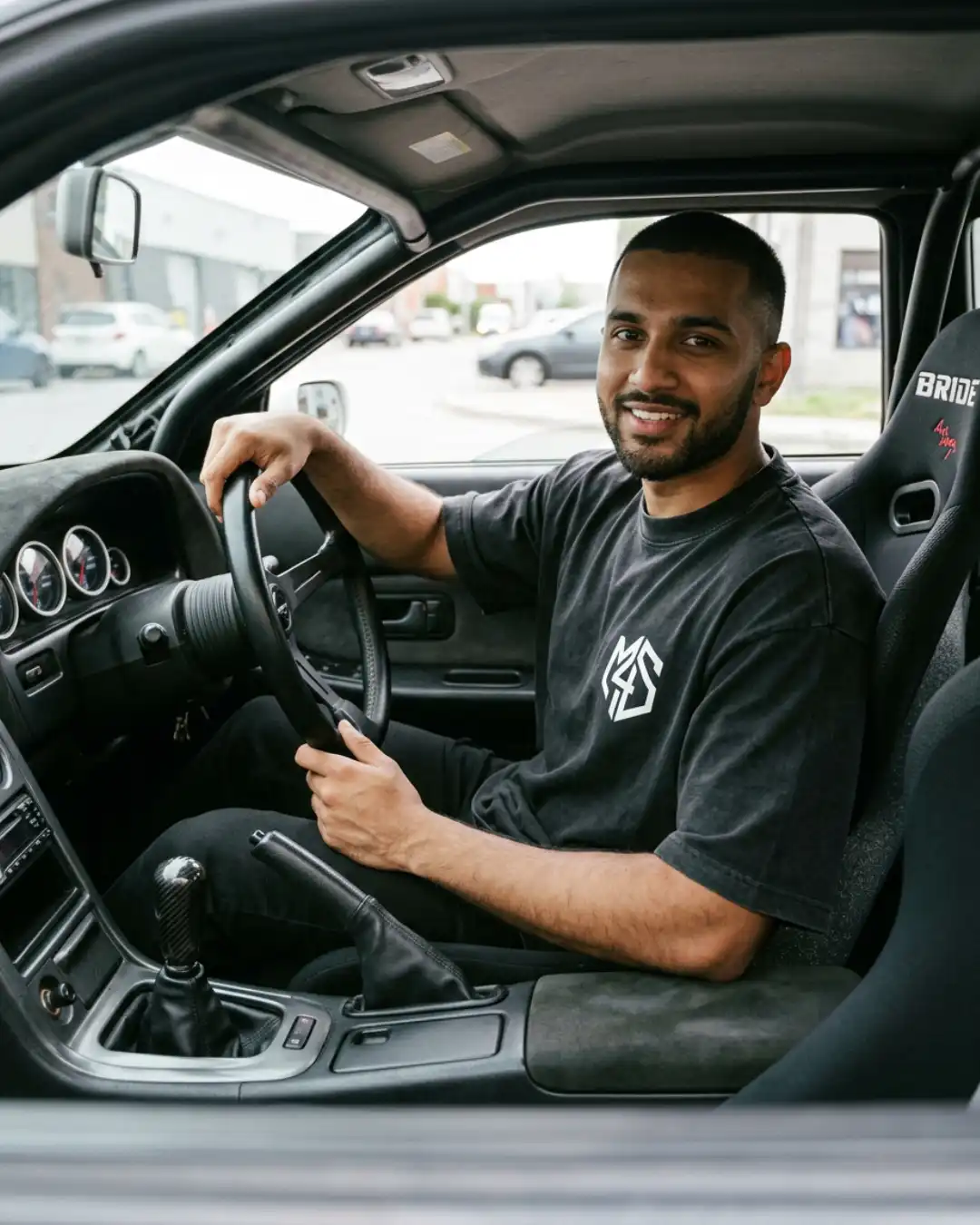 Refuse Autopilot Heavyweight Oversized Tee – Car Lifestyle Male wearing the Refuse Autopilot Heavyweight Oversized Tee while sitting in a car