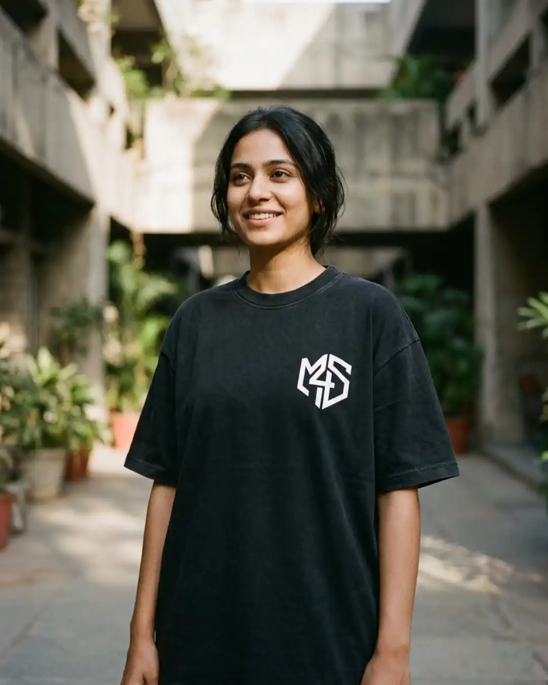 Refuse Autopilot Heavyweight Oversized Tee – Female Lifestyle Female wearing the Refuse Autopilot Heavyweight Oversized Tee while walking through a modern urban setting